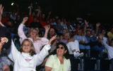 Family members wave at a Family Day event, 2000