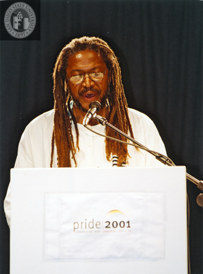 Man speaking from lectern at Pride Rally, 2001