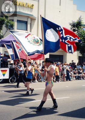 Marchers holding flags of southern states in Pride Parade, 1998