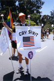 Volunteer holds vertical flag with 1976 Pride theme, 1992