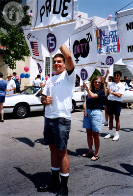 Dan Stiteler holding Lesbian and Gay Historical Society banner, 1994