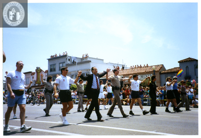 Police march and hold hands at Pride parade, 1998