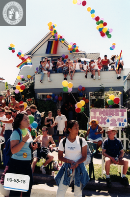 Pride parade watchers at a house, 1999