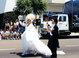 Marchers in wedding costumes in Pride parade, 2000