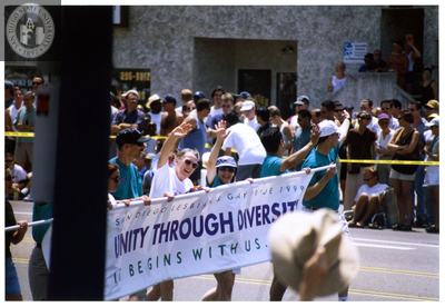 Sheila Clark and Judy Reif carry a banner in Pride parade, 1998
