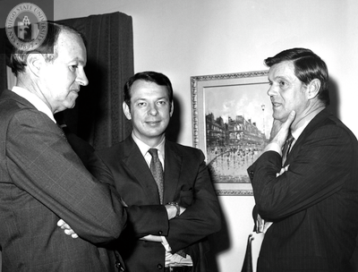 Lionel Van Deerlin standing with two unidentified men