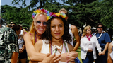 Two women wearing Mardi Gras beads at Commitment Ceremony, 2001