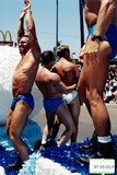 Surfing themed parade float with men in swimsuits, 1997