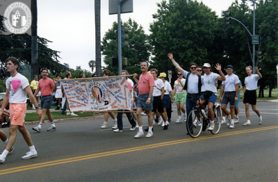 Project Life Guard banner with marchers in Pride Parade, 1991