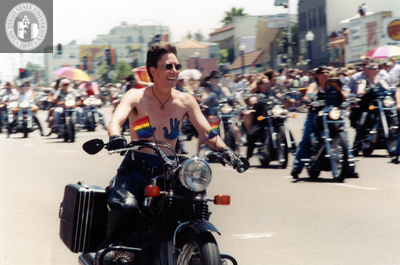 Person on motorcycle at Pride parade, 1999
