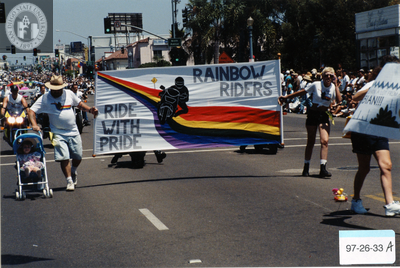 "Rainbow Riders/Ride with Pride" banner at Pride parade, 1997
