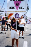 Bev holding Lesbian and Gay Historical Society banner in Pride parade, 1994