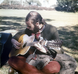 Guitar player at San Diego Gay-In II in Balboa Park, 1971