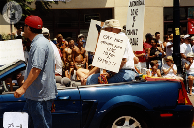 "Gay Kids Straight Kids Love Makes a Family!!" sign in Pride parade, 2000