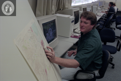 Man with map and computer, 1996