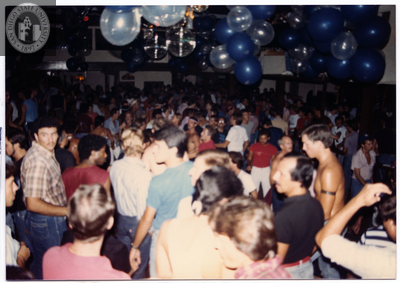 Large room with balloons and crowd of people, 1982