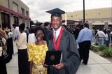 Graduate with his mother, 1999