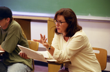 Instructor teaches class from desk chair, 1996