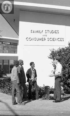 Tour guide with group in front of Family Studies