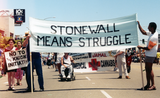 "Stonewall means Struggle" banner in Pride parade, 1999