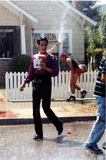 Hose sprays people at Pride parade, 1996