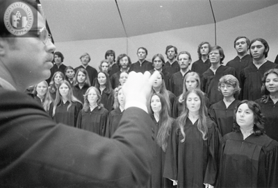 An unidentified conductor leads a chorus