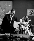 Unidentified actress reading to Mayor Charles C. Dail in Shakespeare Festival, 1958