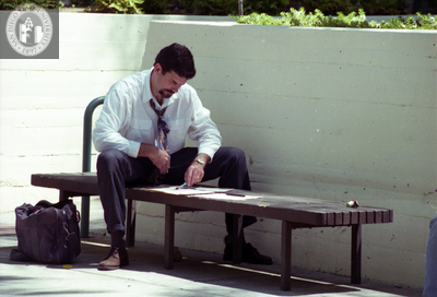 Man using bench for desk, 1996