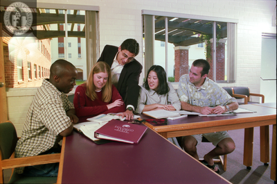 Men and women with San Diego State University materials, 2000