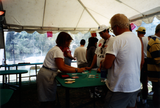 People play blackjack under tent at Pride festival