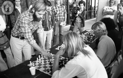 Jim Macki plays 5 separate chess games, 1975