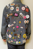 Back of denim jacket with triangle, lambda, and cause and event buttons, 2003