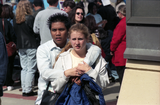 Couple watches something out of frame, 1998