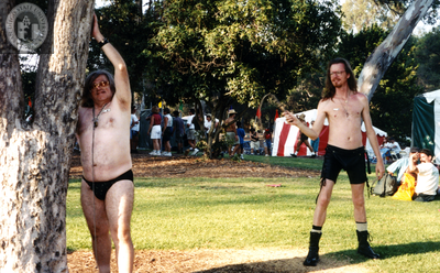 Men adopt sadomasochistic postures at Pride festival, 1996