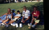 Family on the grass during Family Weekend, 2000