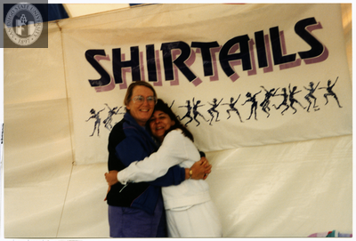 Sheila Clark and Judy Reif hug at Pride Festival, 1999