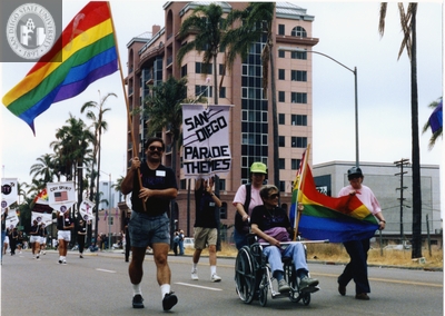 James Burnette and Diann Dinova walking in Pride parade, 1990
