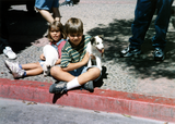 Children sitting on sidewalk for Tijuana Pride parade, 1996