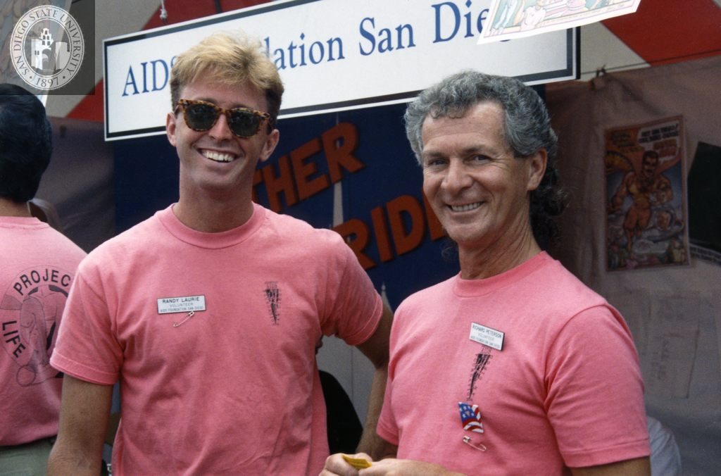 Randy Laurie and Richard Peterson in front of the AIDS Foundation booth, 1991