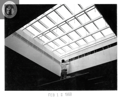Completing skylight, Aztec Center construction, 1968