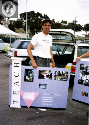 Glen Drake holding LGASD display at Pride festival, 1991