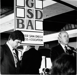 Fred Schnaubelt and George Mitrovich debating at GSDBA luncheon, 1980