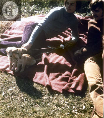 Two people with puppies at San Diego Gay-In II at Balboa Park, 1971