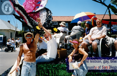 Men and women waiting with float at Pride parade, 1999