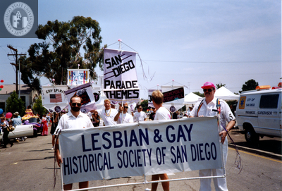 David Wasserman and Doug Moore holding banner in Pride parade, 1994