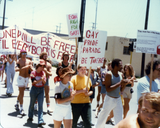 Marchers with sign and banner at Pride parade, 1978
