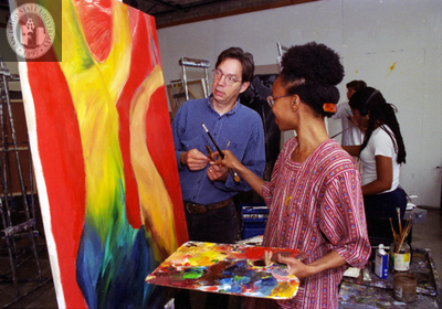 Student painter and instructor with painting, 1996