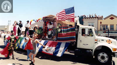 Float with flags and Ms Tom Boy 99 in Pride parade, 1999
