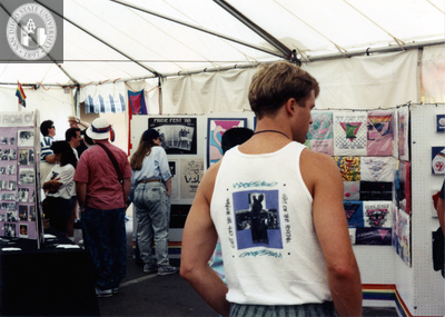 Visitors walking around Archives booth at Pride festival, 1990