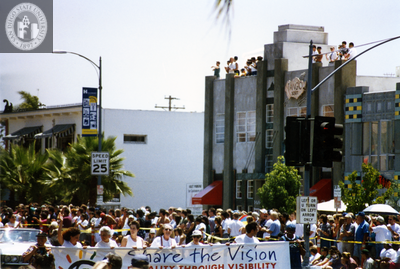 Sheila Clark and Judy Reif carry a banner at Pride parade, 1997